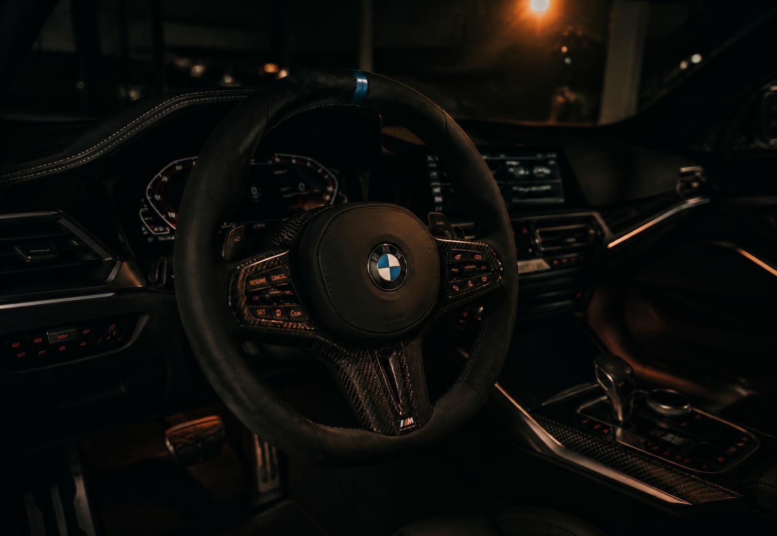 Custom alcantara steering wheel with carbon trim fitted by Ghost Customz